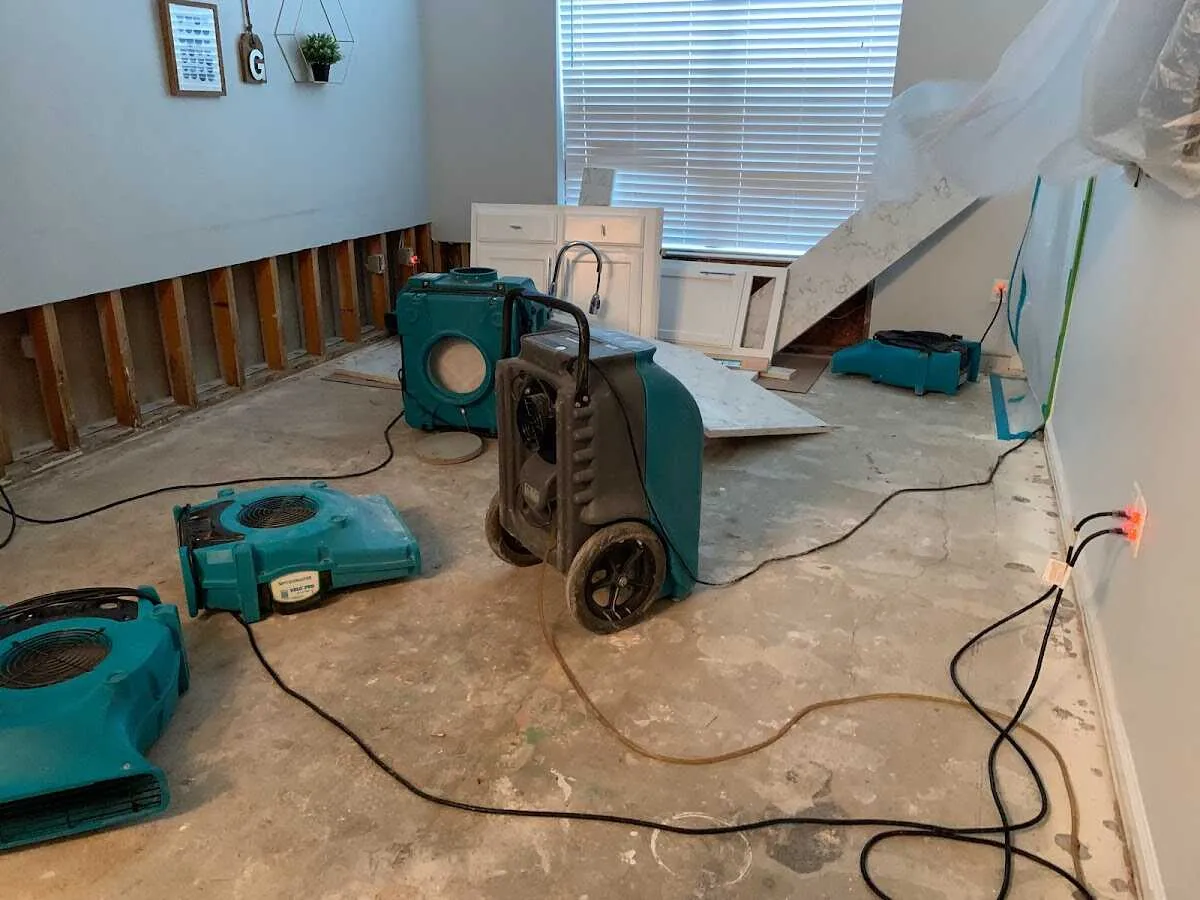 Dehumidifier in flood-cut room for Water Damage Restoration in Seekonk